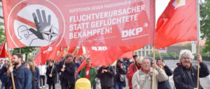 DKP auf der Straße gegen die Migrationspolitik der Bundesregierung (Foto: Uwe Hiksch)